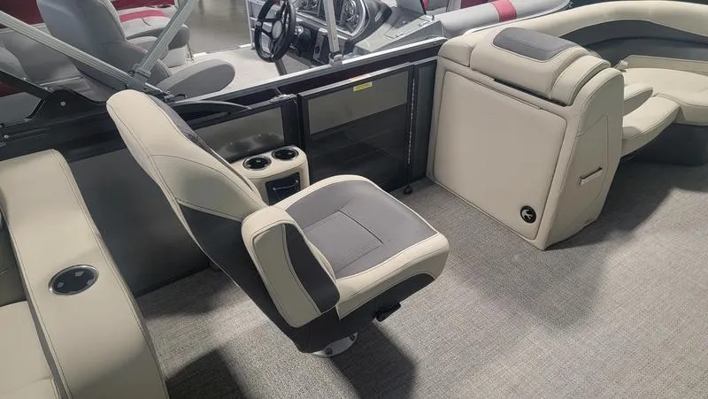 Slide: The Image of 2022 Barletta C20QC boat interior with beige seating and steering wheel. - 6