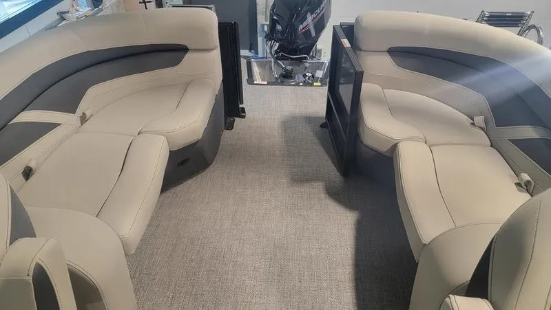 Slide: The Image of 2022 Barletta C20QC boat interior with beige seating and carpeted flooring. - 7