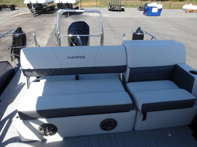 Slide: The Image of 2025 Harris SUNLINER SP 250 boat seating with sleek design and integrated speakers. - 11