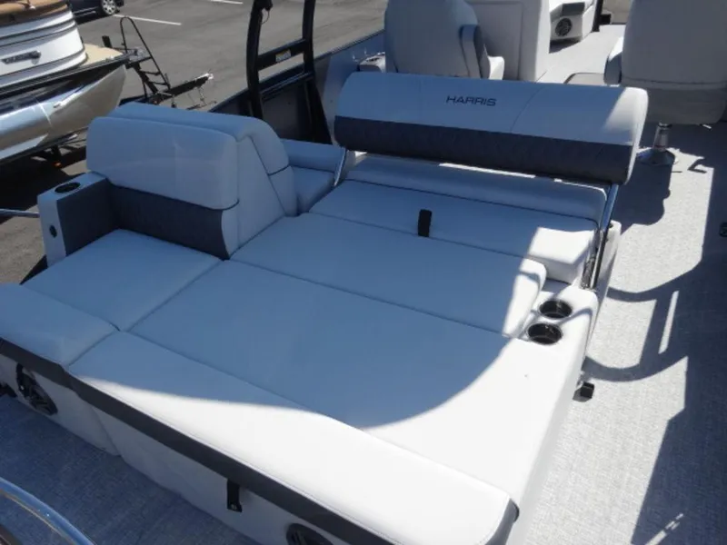 Slide: The Image of 2025 Harris SUNLINER SP 250 boat interior with spacious seating and cup holders. - 12