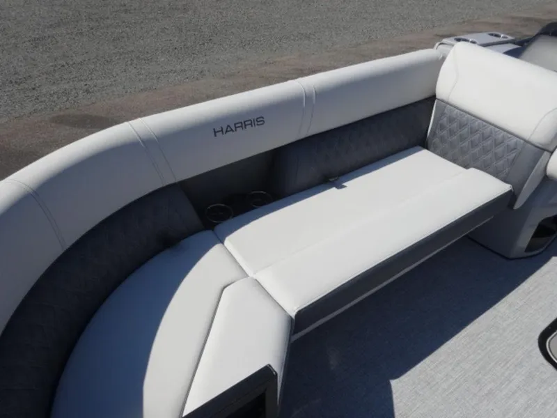 Slide: The Image of 2025 Harris SUNLINER SP 250 boat interior with plush seating and cup holders. - 5