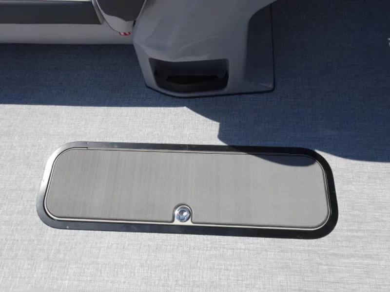 Slide: The Image of Harris SUNLINER SP 250 2025 boat floor compartment with sleek design and secure latch. - 6