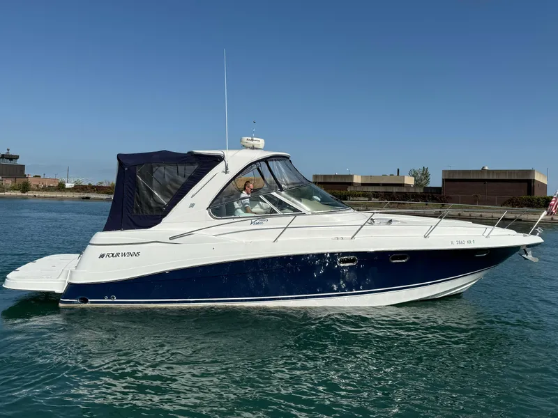 Slide: The Image of 2005 Four Winns 378 Vista boat cruising on clear water. - 1