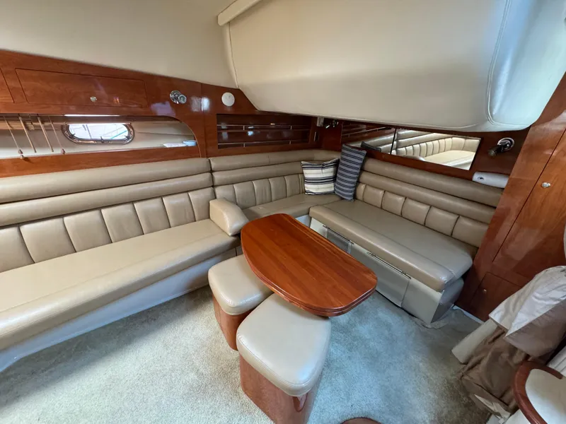 Slide: The Image of Luxurious interior of 2005 Four Winns 378 Vista yacht with leather seating and wooden accents. - 14