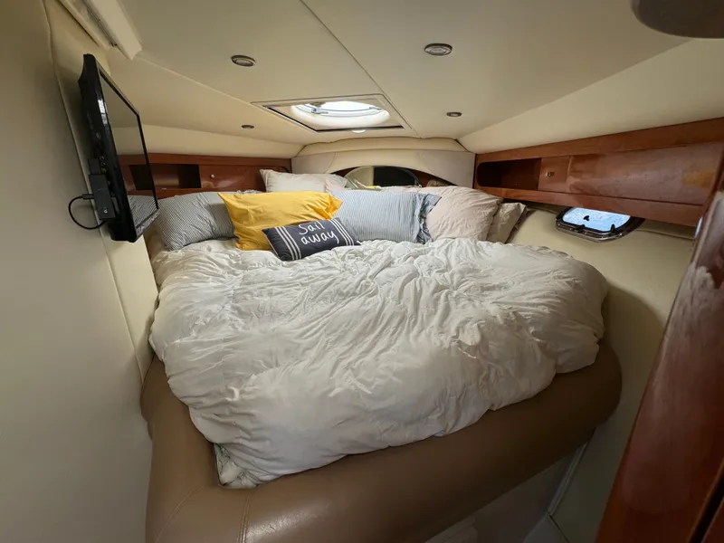Slide: The Image of Cozy cabin interior of 2005 Four Winns 378 Vista yacht with plush bedding and TV. - 17