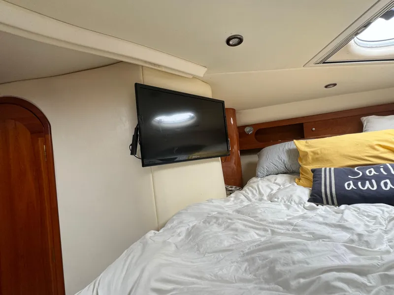 Slide: The Image of Cozy cabin interior of 2005 Four Winns 378 Vista with TV and bedding. - 18