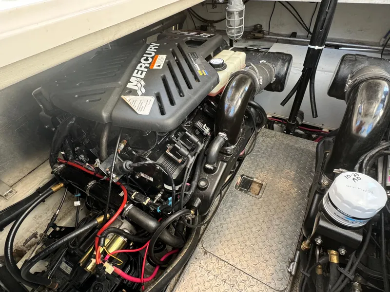 Slide: The Image of Engine compartment of 2005 Four Winns 378 Vista with Mercury engine components. - 22