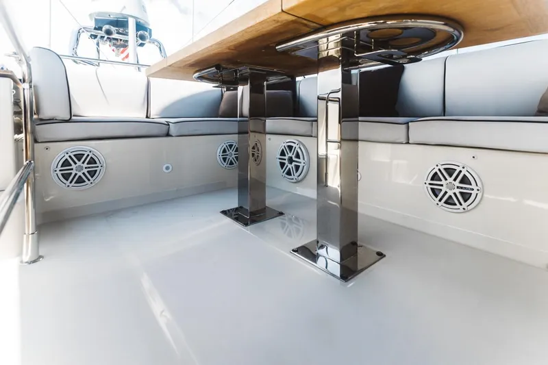 Slide: The Image of 2015 Beneteau Monte Carlo 5 yacht interior with sleek seating and modern table design. - 11