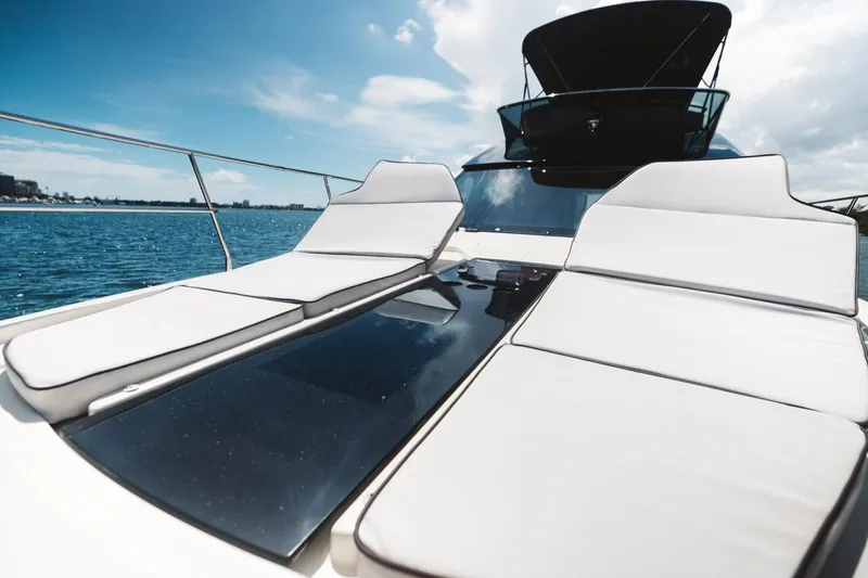 Slide: The Image of Luxurious 2015 Beneteau Monte Carlo 5 yacht with sun loungers on deck. - 2