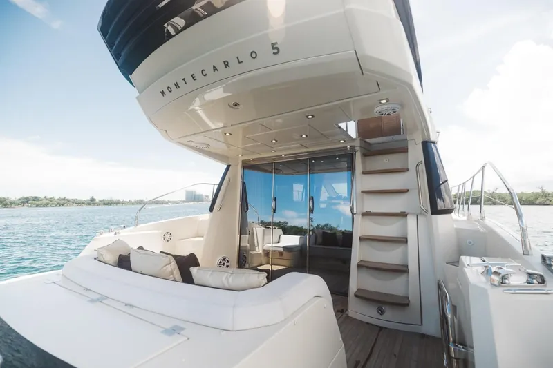 Slide: The Image of 2015 Beneteau Monte Carlo 5 yacht with luxurious deck and seating area. - 20