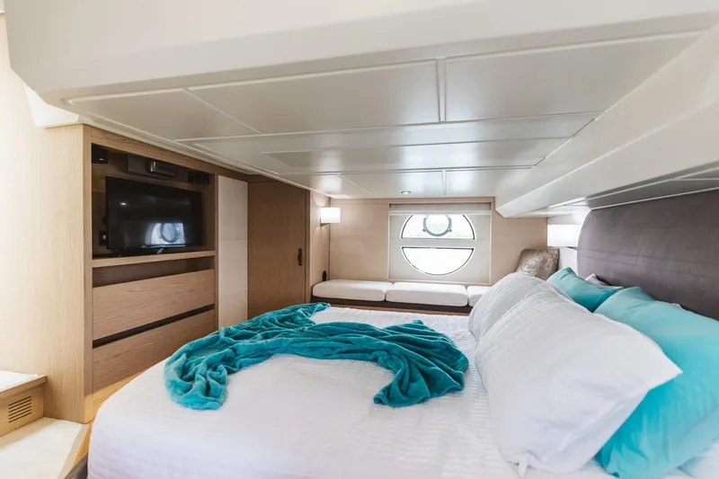 Slide: The Image of Luxurious bedroom in 2015 Beneteau Monte Carlo 5 yacht with modern decor. - 23