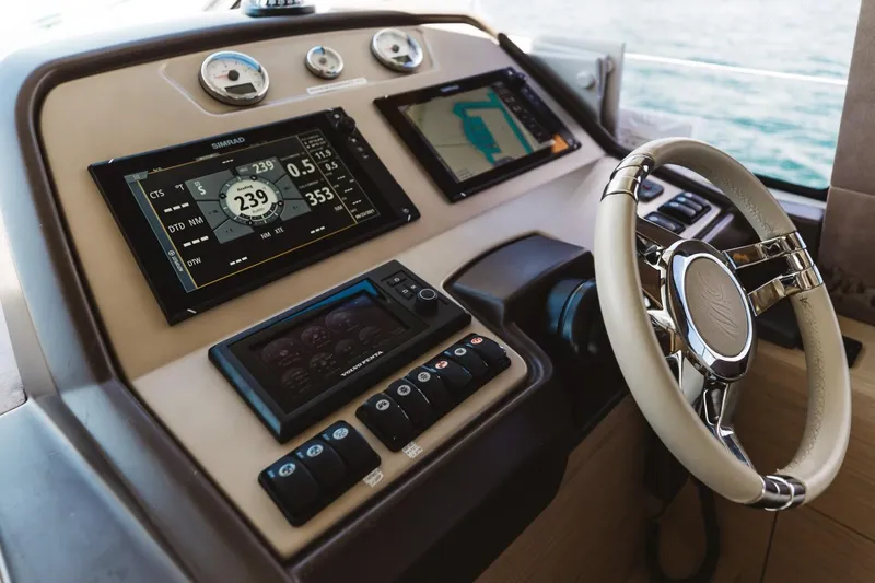 Slide: The Image of Helm of 2015 Beneteau Monte Carlo 5 with modern navigation displays and controls. - 33
