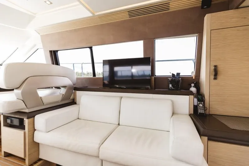 Slide: The Image of Luxurious interior of 2015 Beneteau Monte Carlo 5 yacht with white sofa and TV. - 36