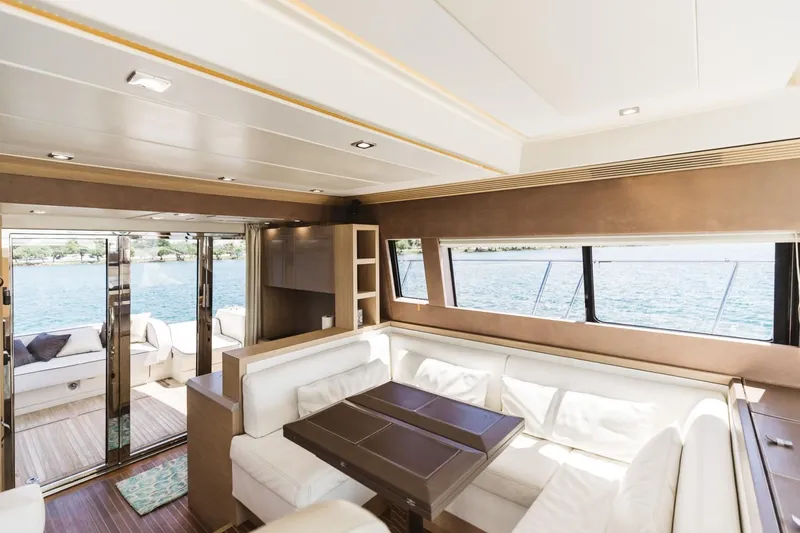 Slide: The Image of Luxurious interior of 2015 Beneteau Monte Carlo 5 yacht with elegant seating and panoramic windows. - 37