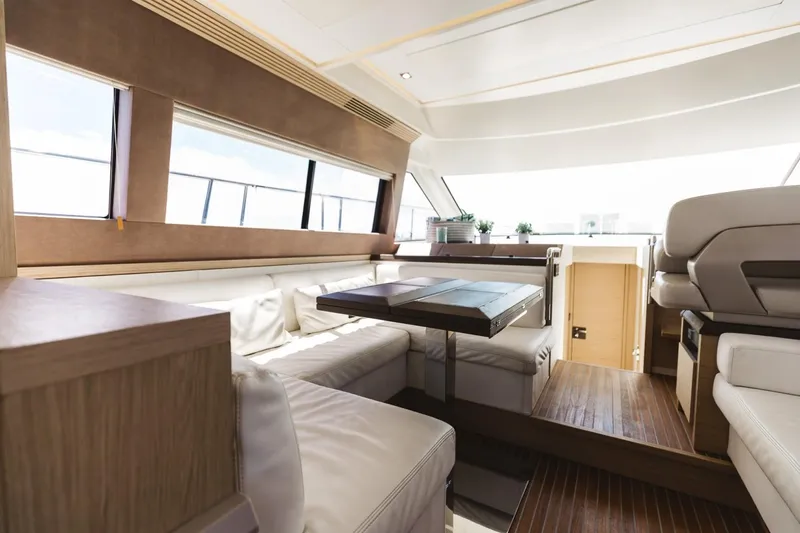 Slide: The Image of Luxurious interior of 2015 Beneteau Monte Carlo 5 yacht with elegant seating and wooden accents. - 45