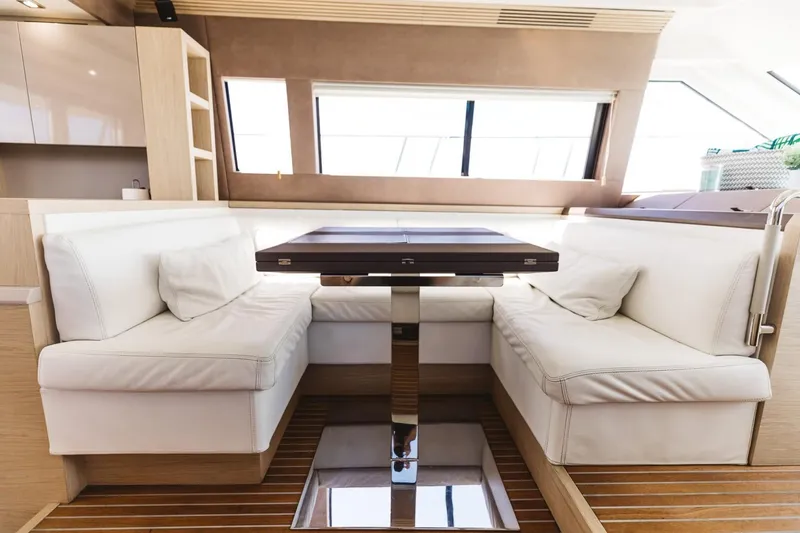 Slide: The Image of Luxurious interior of 2015 Beneteau Monte Carlo 5 yacht with elegant seating and table. - 46