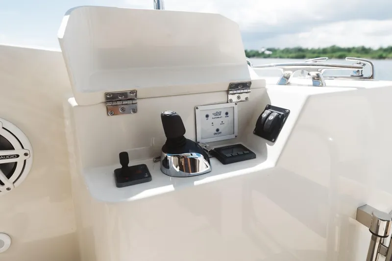 Slide: The Image of Control panel of 2015 Beneteau Monte Carlo 5 yacht, featuring joystick and navigation controls. - 5