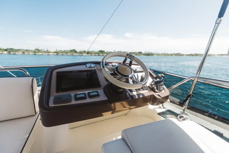 Slide: The Image of Steering console of 2015 Beneteau Monte Carlo 5 yacht with ocean view. - 9