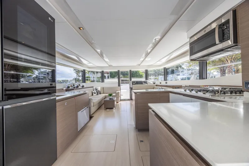 Slide: The Image of Luxurious interior of 2024 Leopard 53 Powercat yacht with modern kitchen and seating area. - 19