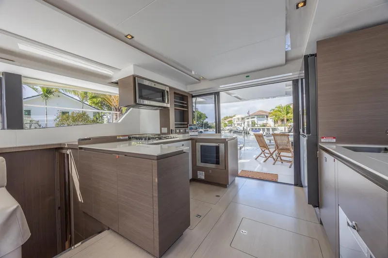Slide: The Image of Luxurious kitchen interior of 2024 Leopard 53 Powercat yacht with modern appliances and outdoor view. - 22