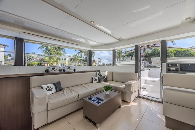 Slide: The Image of Luxurious interior of 2024 Leopard 53 Powercat yacht with modern seating and panoramic windows. - 23