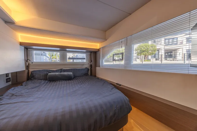 Slide: The Image of Luxurious bedroom interior of 2024 Leopard 53 Powercat yacht with modern design and large windows. - 28
