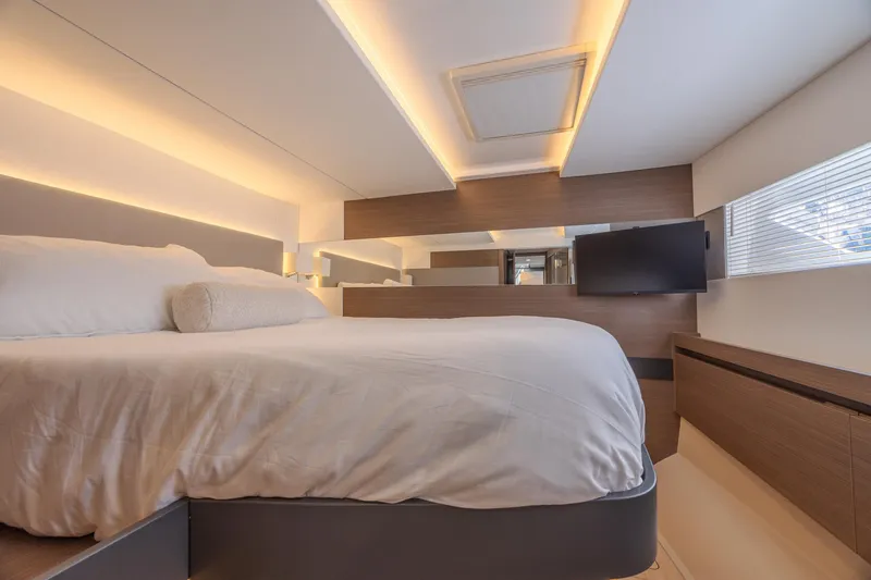 Slide: The Image of Luxurious bedroom interior of 2024 Leopard 53 Powercat yacht with modern lighting and sleek design. - 30