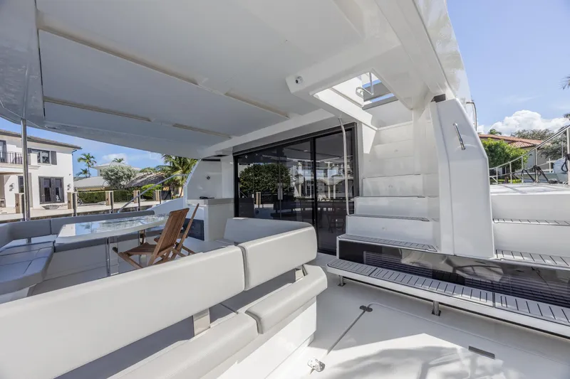 Slide: The Image of 2024 Leopard 53 Powercat yacht interior with modern seating and sleek design. - 9