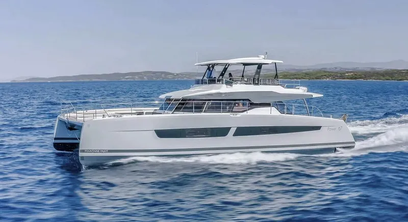 Slide: The Image of 2025 Fountaine Pajot Power 67 yacht cruising on open sea, showcasing sleek design and luxury. - 2