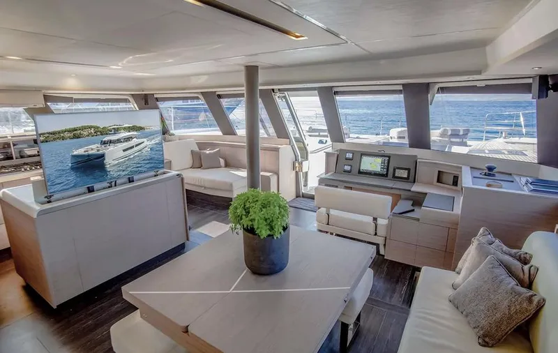 Slide: The Image of Luxurious interior of 2025 Fountaine Pajot Power 67 yacht with modern furnishings and ocean view. - 25