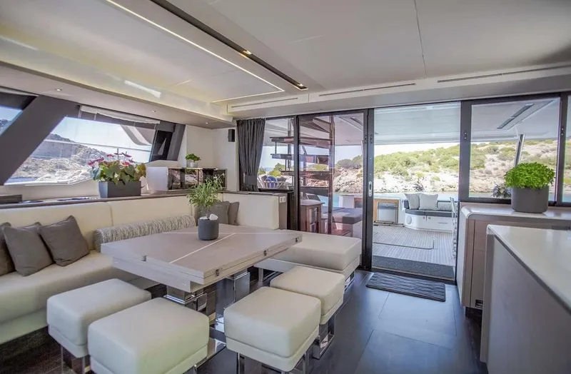 Slide: The Image of Luxurious interior of 2025 Fountaine Pajot Power 67 yacht with modern seating and scenic views. - 27