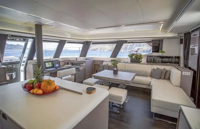 Slide: The Image of Luxurious interior of 2025 Fountaine Pajot Power 67 yacht with panoramic windows and modern furnishings. - 29