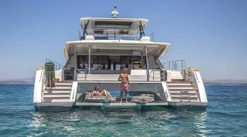 Slide: The Image of 2025 Fountaine Pajot Power 67 yacht on water, featuring spacious deck and lounging area. - 4