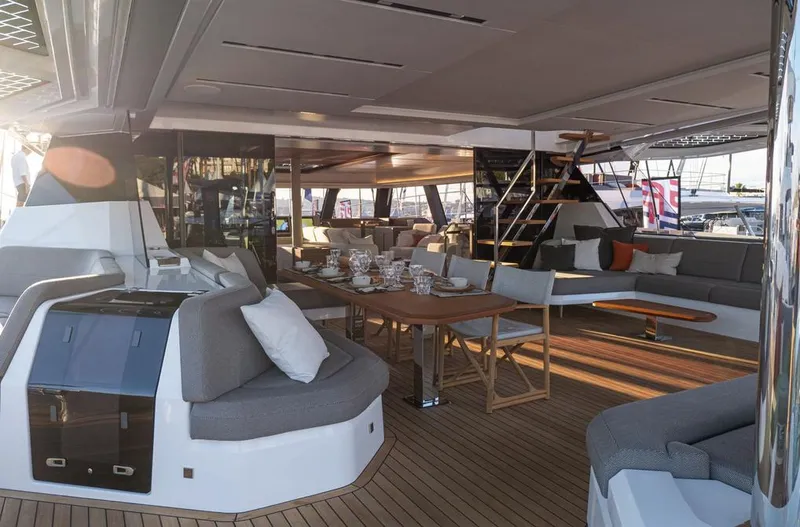 Slide: The Image of Luxurious 2025 Fountaine Pajot Power 80 yacht interior with elegant seating and dining area. - 13