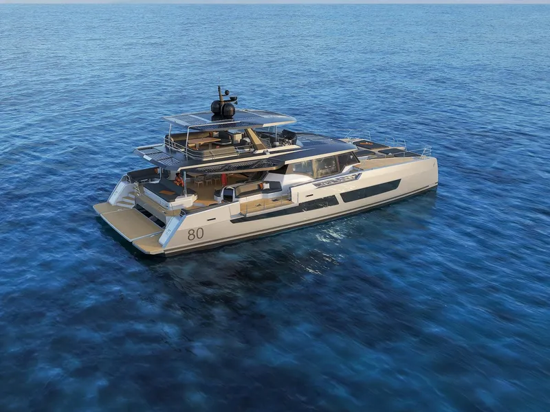 Slide: The Image of 2025 Fountaine Pajot Power 80 yacht cruising on open sea, showcasing luxury design. - 2