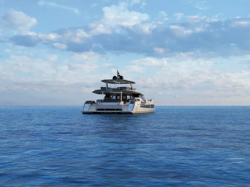 Slide: The Image of Fountaine Pajot Power 80 yacht, 2025 model, cruising on calm ocean waters under a cloudy sky. - 22