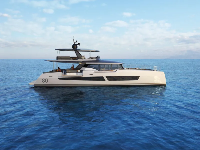 Slide: The Image of 2025 Fountaine Pajot Power 80 yacht cruising on open sea under clear skies. - 4