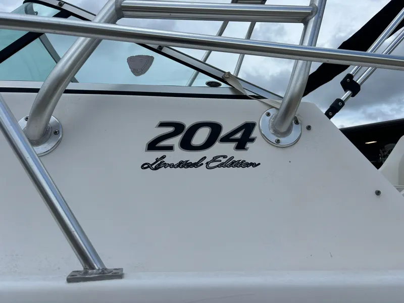 Slide: The Image of Angler 204WA 2008 Limited Edition boat detail with railing and logo. - 10