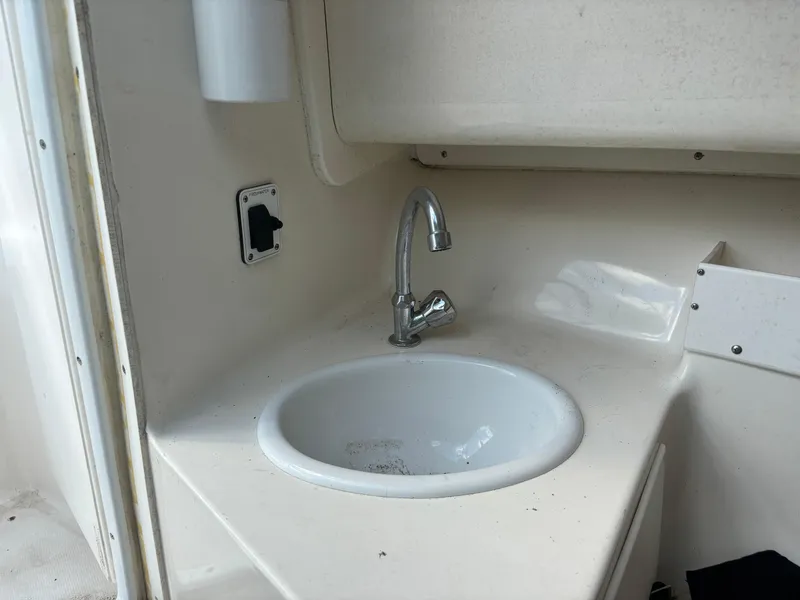 Slide: The Image of 2008 Angler 204WA boat interior sink with faucet. - 15