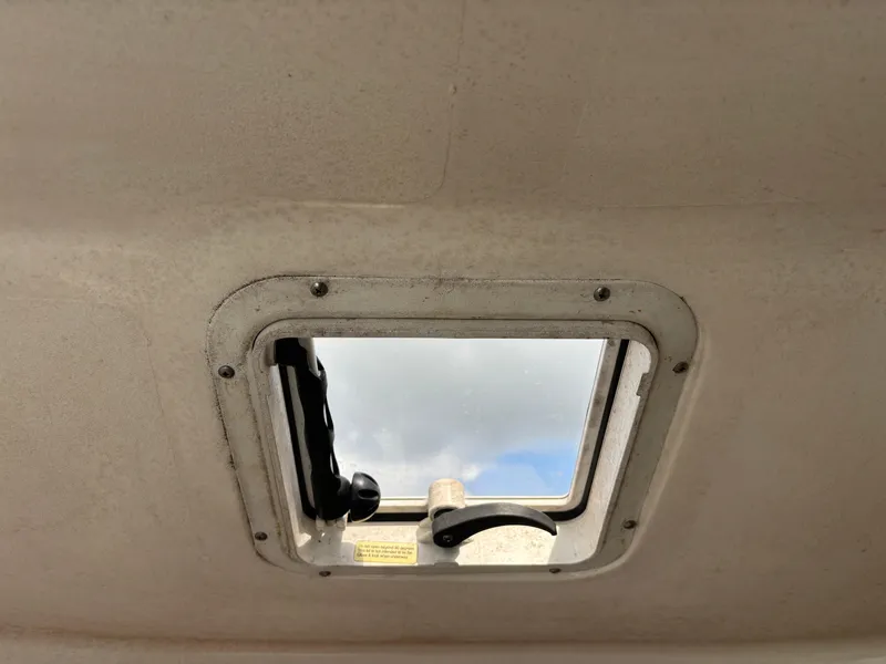 Slide: The Image of Angler 204WA 2008 boat cabin window with sky view. - 17