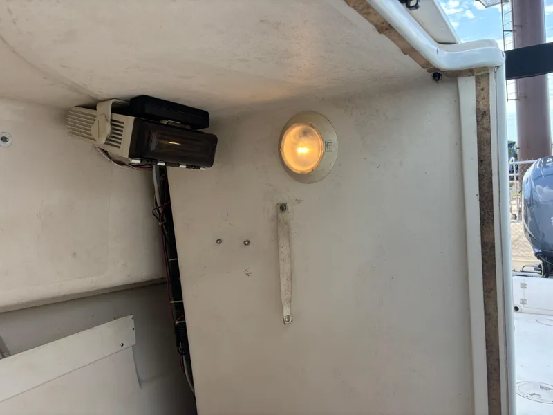 Slide: The Image of Interior view of a 2008 Angler 204WA boat, featuring a light and electronic device. - 18