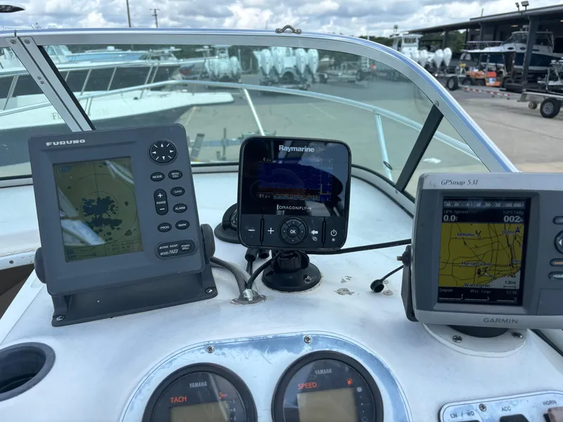 Slide: The Image of 2008 Angler 204WA boat dashboard with navigation and sonar equipment. - 29