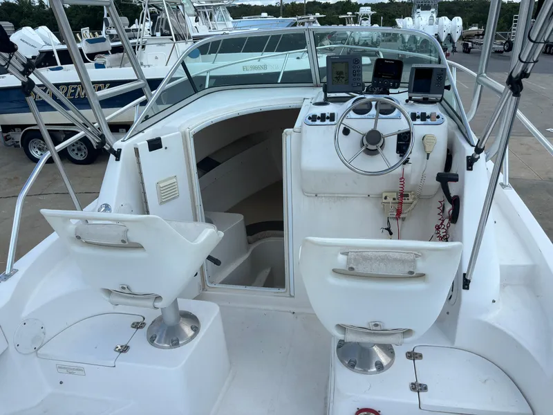 Slide: The Image of 2008 Angler 204WA boat interior with steering wheel and seating. - 33