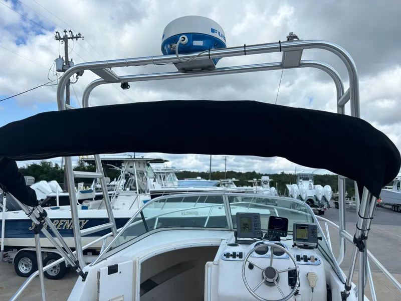 Slide: The Image of 2008 Angler 204WA boat dashboard with navigation equipment and canopy. - 34