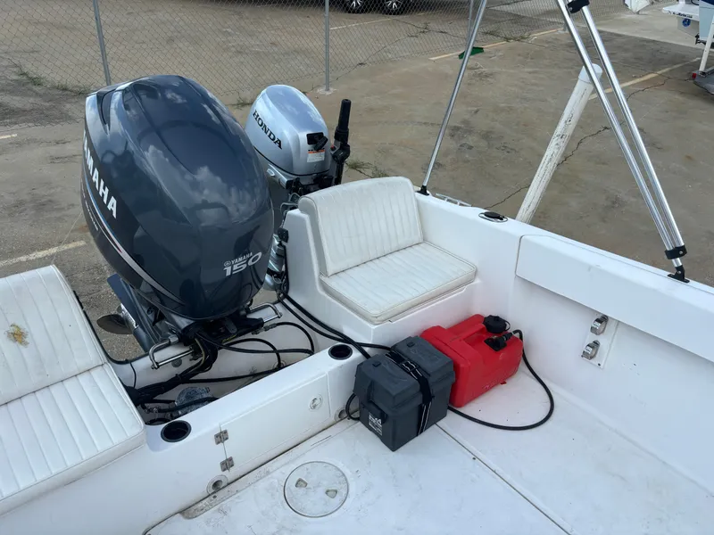Slide: The Image of 2008 Angler 204WA boat with Yamaha and Honda outboard motors, white seating, and fuel tank. - 35