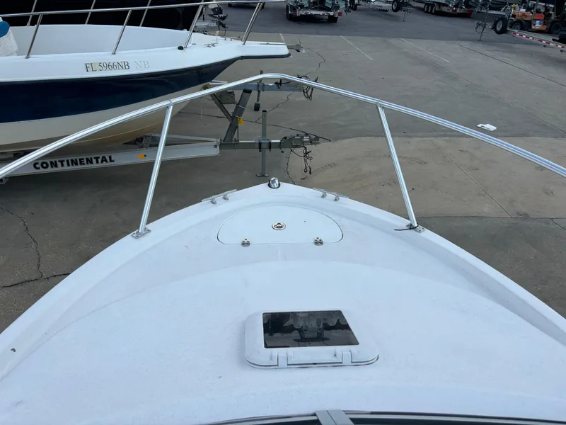 Slide: The Image of 2008 Angler 204WA boat bow view at a marina. - 43