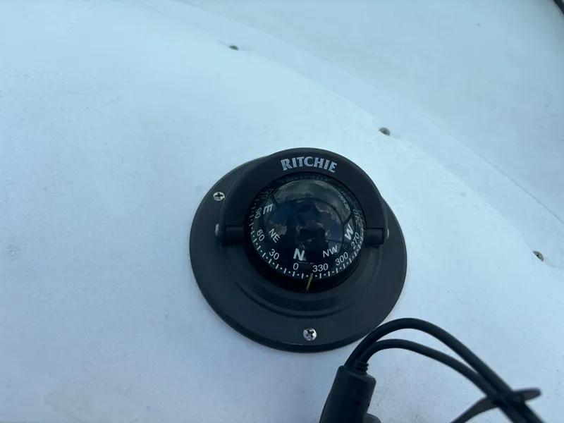 Slide: The Image of Ritchie compass on 2008 Angler 204WA boat dashboard. - 44