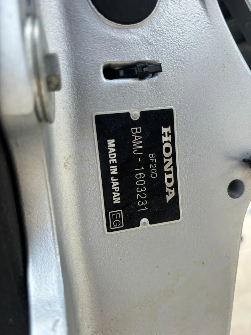 Slide: The Image of Close-up of a Honda BF20D engine label on a 2008 Angler 204WA boat. - 8