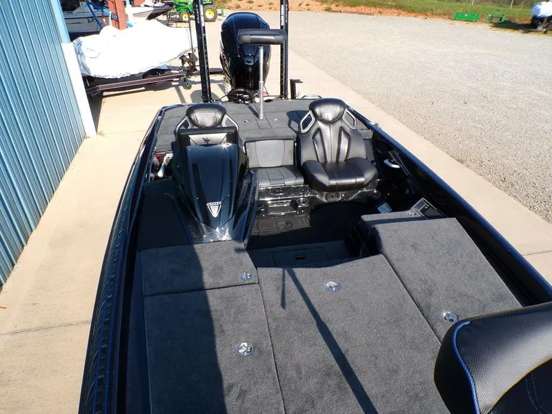 Slide: The Image of 2025 Skeeter FXR20L fishing boat interior with dual seats and spacious deck. - 14