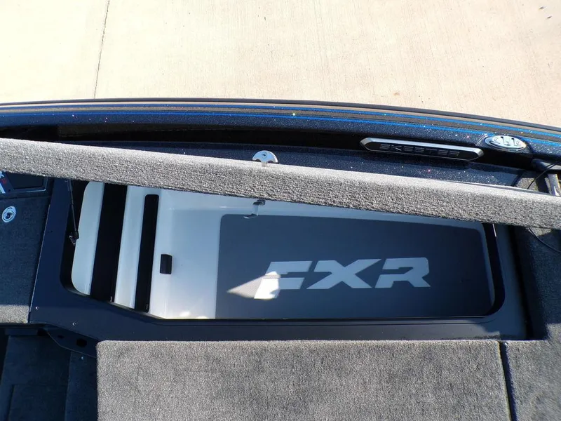 Slide: The Image of 2025 Skeeter FXR20L boat storage compartment with FXR branding. - 17